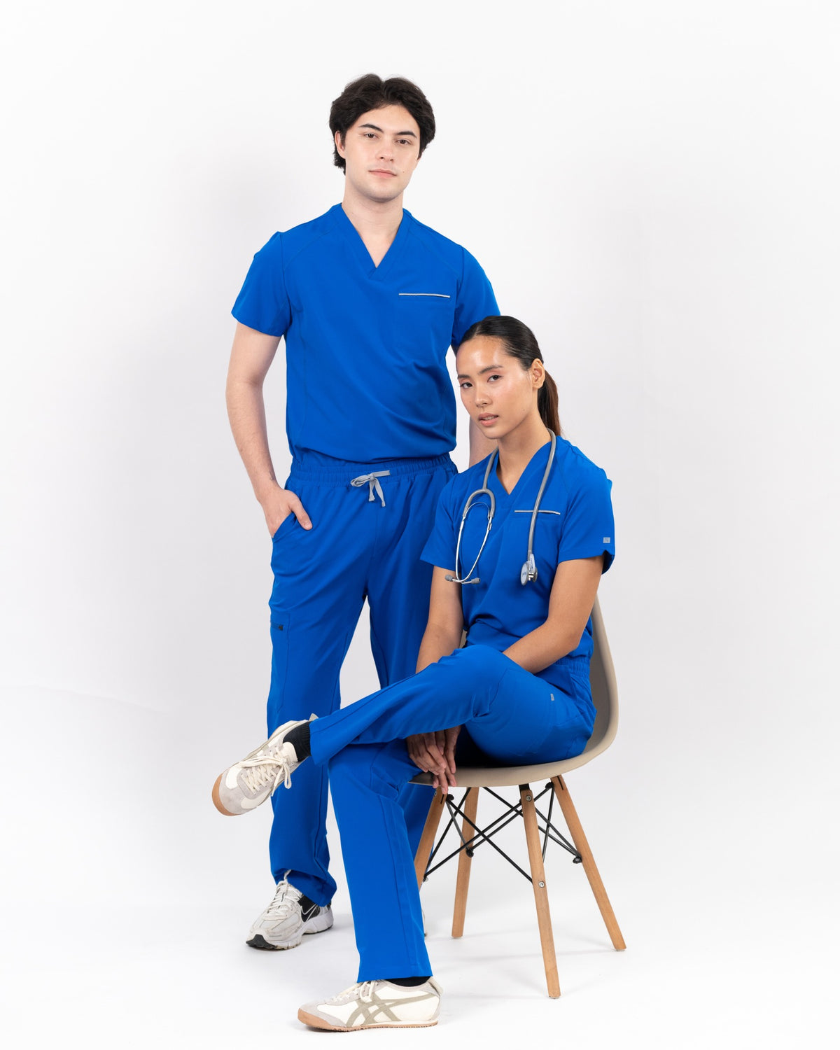 Elite scrub set in Royal Blue on two models